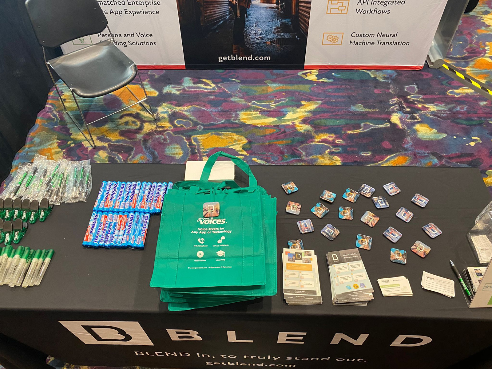 BLEND booth view with promo collateral and giveaway items