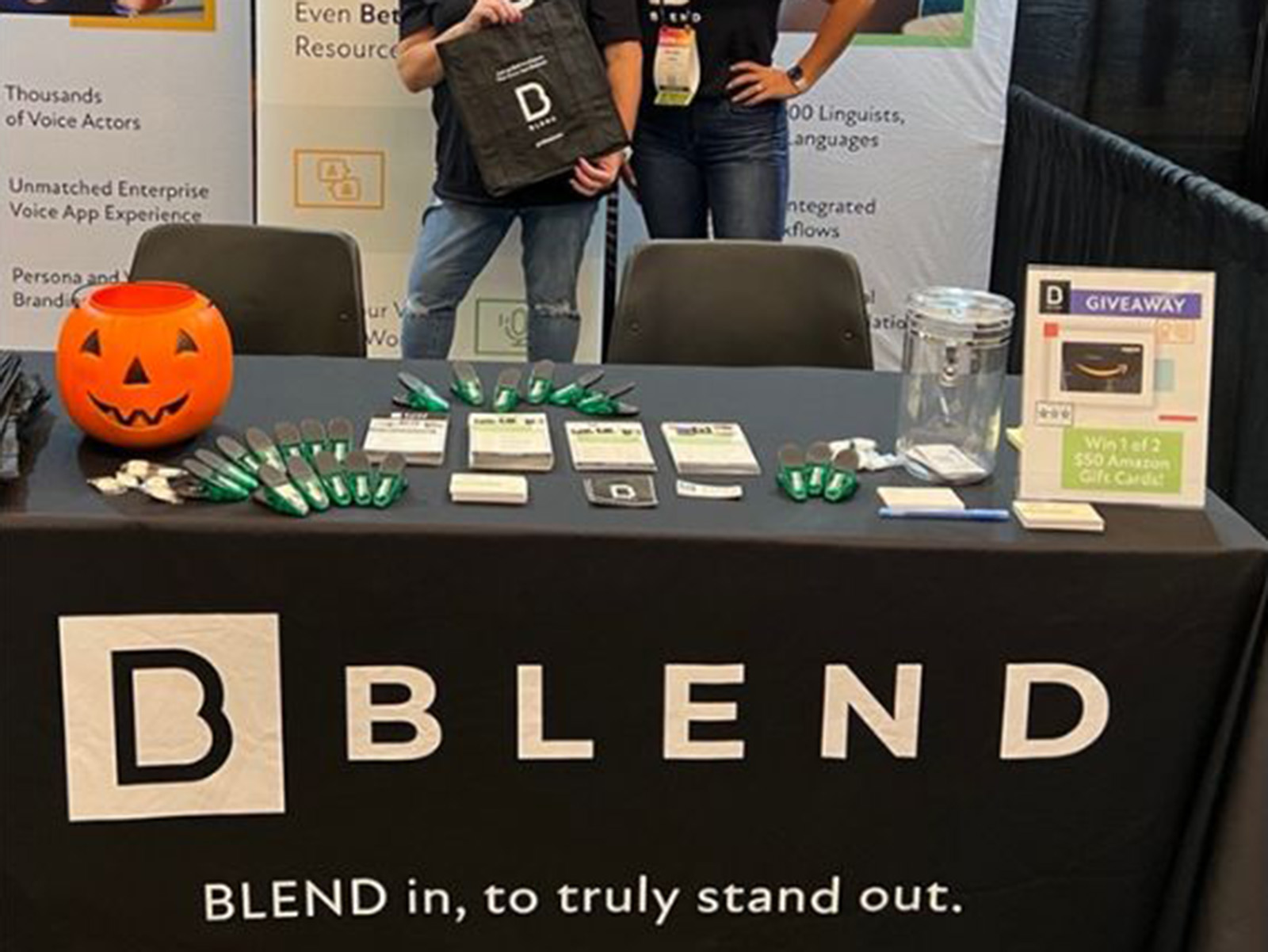 BLEND booth table with printed collateral and signage