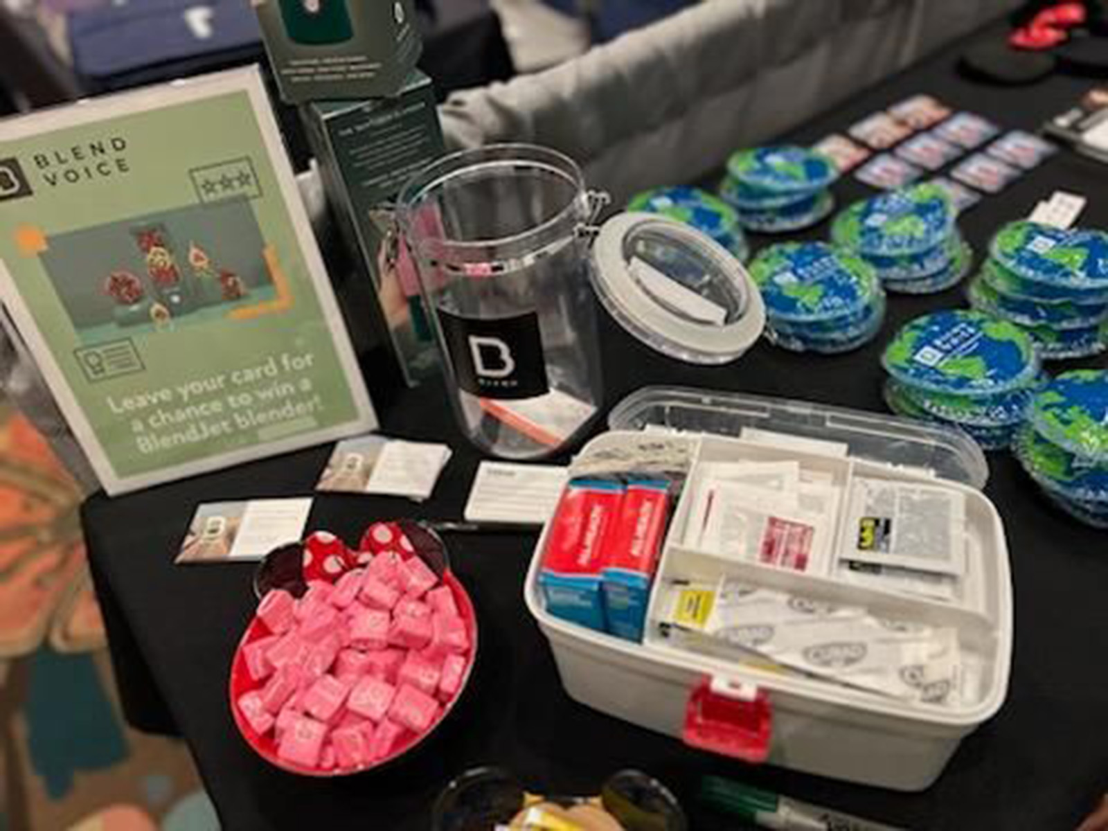 Close-up of BLEND booth giveaway items and promo signage